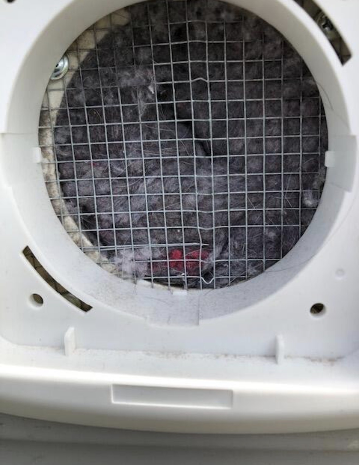 Dryer lint screen housing full of trapped lint
