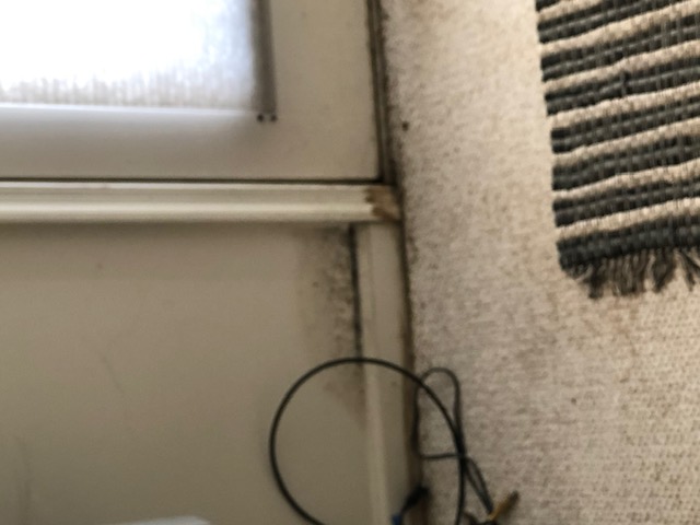 Water staining in a door corner