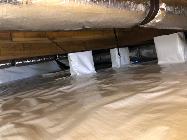 Clean encapsulated crawlspace liner installed by Prism Enterprises