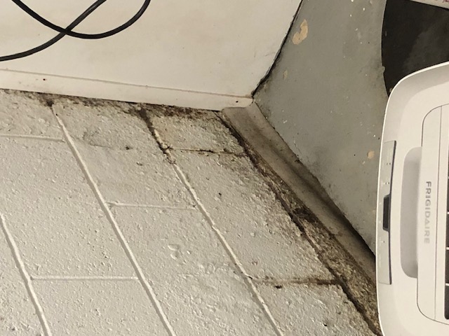 Water stains on a basement block wall